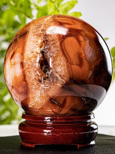 Polished Carnelian Sphere With Crystallized Cavity With Stand