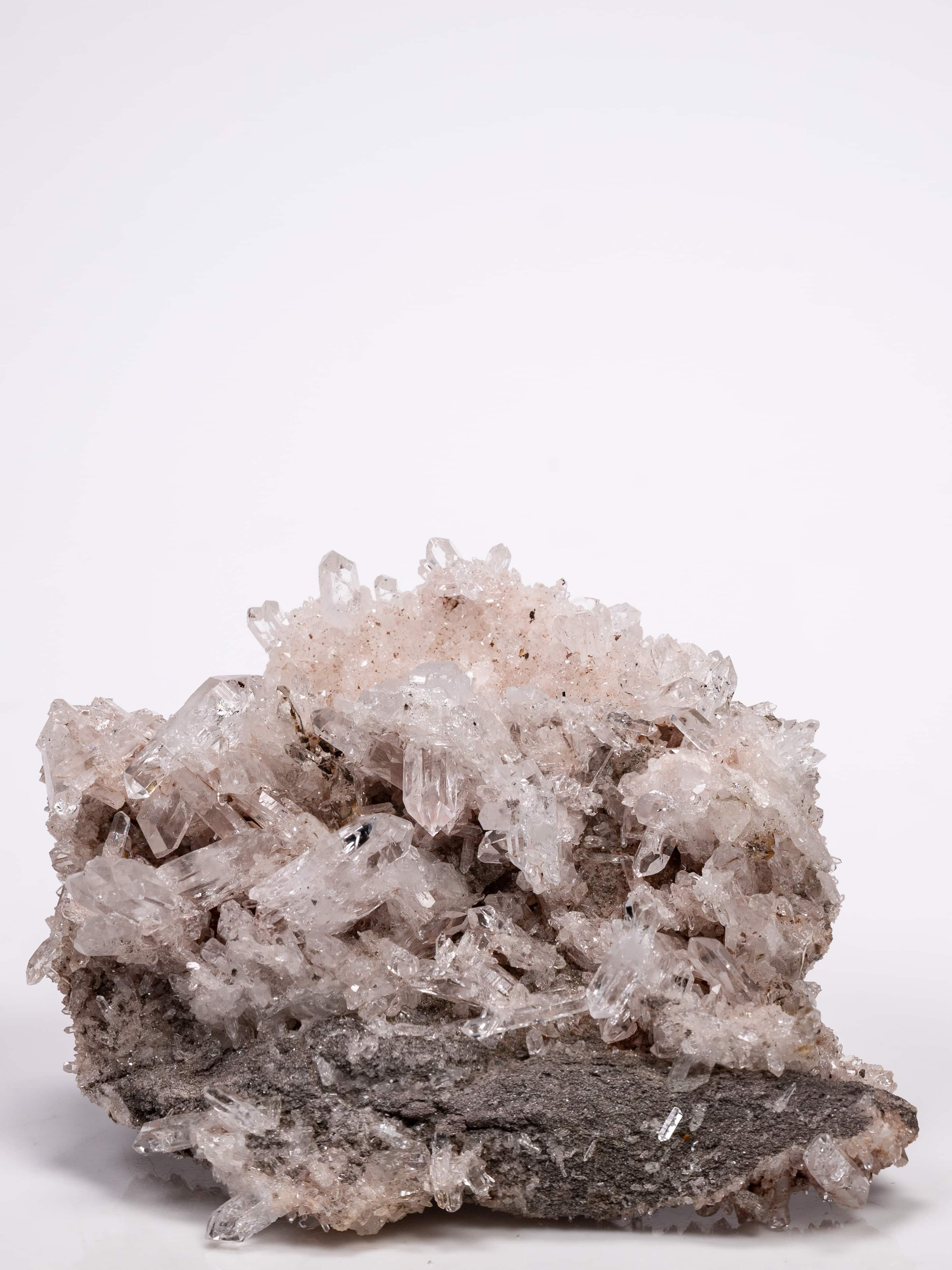 Colombian Sacred Rosé Pink Lithium Silver Light quartz cluster showing clear double terminated points on dark matrix